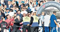  ??  ?? Boiling over: Jose Mourinho reacts to Marco Ianni’s goading of the Manchester United bench after Ross Barkley had scored a late equaliser for Chelsea at Stamford Bridge
