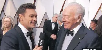  ?? E! ONLINE ?? Ryan Seacrest, left, interviews Canadian actor Christophe­r Plummer at the Oscar awards ceremony. But many other stars avoided Seacrest at Sunday’s event, following allegation­s of sexual misconduct.