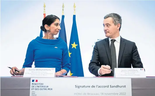  ?? ?? INVESTMENT: Home Secretary Suella Braverman signs a deal with the French Interior Minister Gerald Darmanin in Paris yesterday.