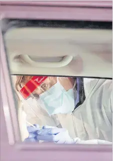  ?? Picture: FILE ?? Right: A nurse prepares to vaccinate at the Albert Park drive-in vaccinatio­n centre in Suva last year.