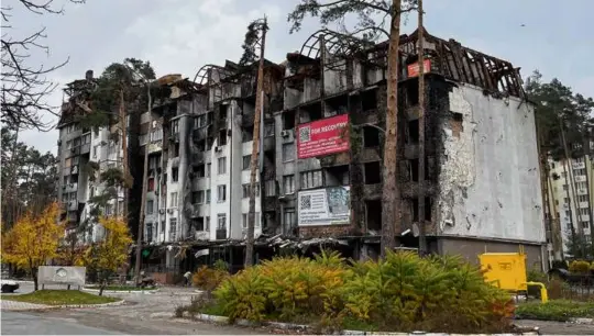  ?? PHOTOS BY ADRIAN BONENBERGE­R ?? An apartment building in Irpin, Ukraine. Heavily damaged during the fight to retake the town in April, it serves as evidence of the toll that Ukrainian civilians have suffered at the hands of Russia.