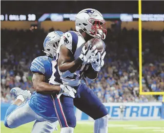  ?? StAff PHoto by NANCy LANE ?? GRABBING A BIGGER ROLE: James White makes a catch for the Patriots’ lone touchdown in last Sunday’s loss to the Lions in Detroit.