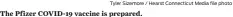  ?? Tyler Sizemore / Hearst Connecticu­t Media file photo ?? The Pfizer COVID-19 vaccine is prepared.