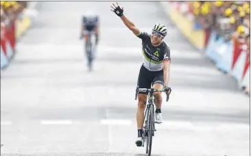  ?? PETER DEJONG / ASSOCIATED PRESS ?? Norway’s Edvald Boasson Hagen celebrates his first stage victory of 2017 as he crosses the finish line Friday to win the 19th stage of the Tour de France, more than 12 minutes ahead of this year’s top racers.