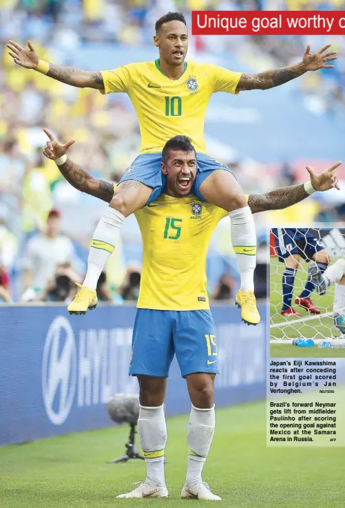  ?? AFP ?? Brazil’s forward Neymar gets lift from midfielder Paulinho after scoring the opening goal against Mexico at the Samara Arena in Russia.