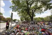  ?? ERIC GAY — THE ASSOCIATED PRESS ?? Pecan trees shade a memorial created to honor the victims killed in the recent school shooting at Robb Elementary in Uvalde, Texas, on Thursday.