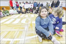  ?? (River Valley Democrat-Gazette/Hank Layton) ?? Genesis Fuentes (front) and others gather for a group photo Friday during the Girls Inc. event.