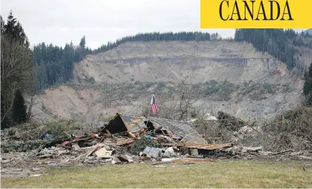  ?? ELAINE THOMPSON / THE ASSOCIATED PRESS FILES ?? After a 2014 mudslide devastated a rural riverside community in the Cascade Mountain foothills near Oso, Wash., John Reed was forced to sell his land to the county. Police believe he murdered his two neighbours, whom he’d had a long-standing feud with,...