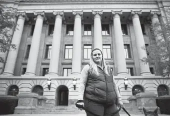  ?? Photos by Helen H. Richardson, The Denver Post ?? Amy Barton, standing in front of the Weld County Courthouse on Wednesday in Greeley, wants her case reheard after the judge who presided over it recently was disbarred and resigned amid a cocaine ring investigat­ion.