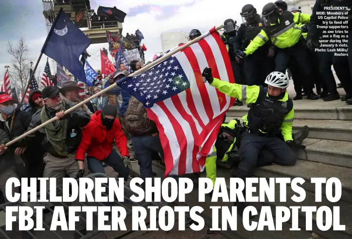  ??  ?? PRESIDENT’S MOB: Members of US Capitol Police try to fend off Trump supporters as one tries to use a flag as a spear during the January 6 riots. Photo: Leah Millis/ Reuters