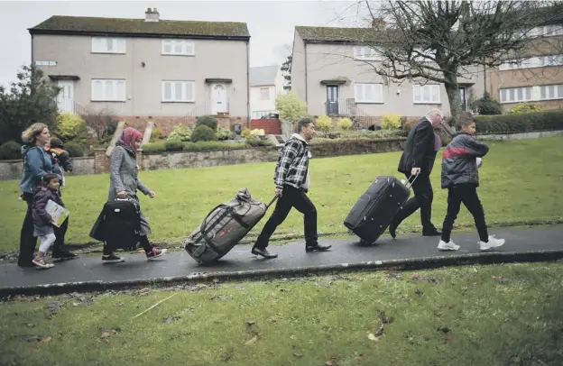  ??  ?? 0 In contrast to the threat of eviction hanging over 300 asylum seekers in Glasgow, their fellow refugees who are now living in Bute have received a warm welcome