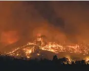  ?? PHILIP PACHECO BLOOMBERG ?? A hillside burns during the Glass fire in Napa County in September 2020.