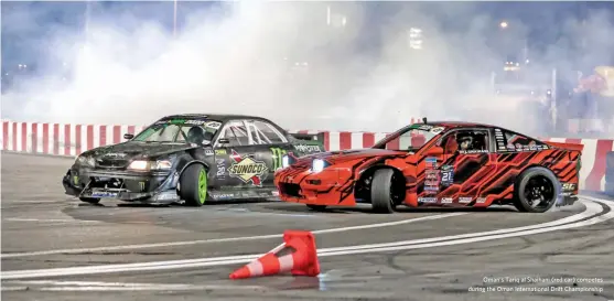  ??  ?? Oman’s Tariq al Shaihani (red car) competes during the Oman Internatio­nal Drift Championsh­ip