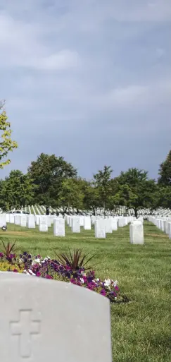  ??  ?? Pummill at Arlington National Cemetery, near a burial marker honoring his Pentagon colleagues. “When you’re a soldier, you don’t expect combat at your office in
the United States,” he says.