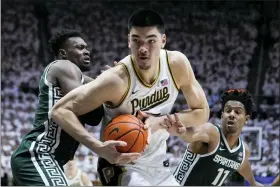  ?? MICHAEL CONROY — THE ASSOCIATED PRESS ?? Purdue center Zach Edey (15) moves to the basket between Michigan State center Mady Sissoko (22) and guard A.J. Hoggard (11)during the game in West Lafayette, Ind., Jan. 29.