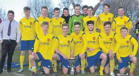  ??  ?? Ferry Yellow U/19s look jubilant as they pose with the George Kerr - Maryfield Trophy following a win over Dryburgh.