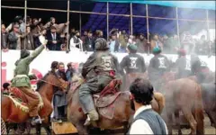  ?? AFP ?? Buzkashi is played by two teams of six horsemen who fight for possession of a beheaded animal carcass such as a goat.