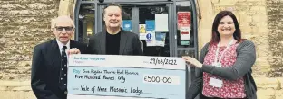  ?? ?? Cheque presentati­on to Sue Ryder