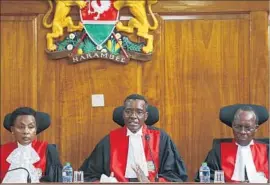  ??  ?? CHIEF JUSTICE David Maraga, center, with Deputy Chief Justice Philomena Mwilu and Justice Jackton Ojwang, delivers the full judgment.