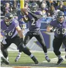  ?? LLOYD FOX/BALTIMORE SUN PHOTO ?? Tyrod Taylor (2) takes a snap from center in the first quarter. Taylor played a total of a dozen plays, five at quarterbac­k.