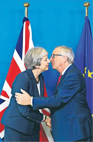  ??  ?? Theresa May meets Jean-claude Juncker, the president of the European Commission, at the talks in Brussels