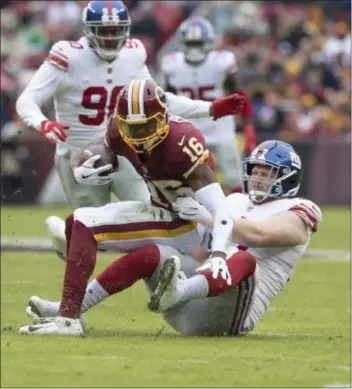  ?? JOHN BLAINE — FOR THE TRENTONIAN ?? Giants defensive lineman Josh Mauro (97) tackles Redskins receiver Jehu Chesson (160) during last week’s game in Landover, Maryland.