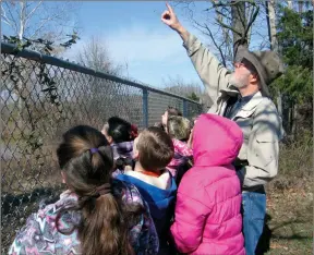  ?? The Associated Press ?? This image provided by Steve Kistler shows Kistler teaching third-graders at the Cub Run, Kentucky, Elementary School about birds during the Great Backyard Bird Count in February 2012. The count is a citizen science project that collects data used by researcher­s to track bird population­s.