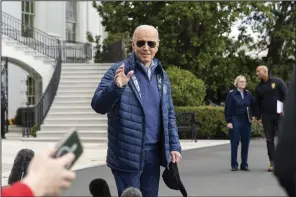  ?? (AP/Alex Brandon) ?? President Joe Biden waves as he walks to Marine One for departure from the South Lawn of the White House on Friday.