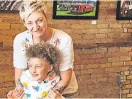  ?? PRESS] ?? This Friday photo shows Alexis Arnold, 44, a gallery and gift shop owner in De Pere, Wis., with her 6-year-old daughter Jade Arnold. [KATHLEEN HENNESSEY/ THE ASSOCIATED