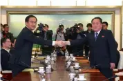  ?? AFP ?? In this file photo South Korea’s unificatio­n minister, Cho Myung- Gyun ( left), shakes hands with North Korean chief delegate Ri Son- Gwon during their meeting at the border truce village of Panmunjom. —