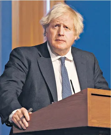  ?? ?? Boris Johnson announcing the tougher Covid rules last night. He faced criticism over the alleged lockdownbr­eaking No 10 Christmas party last year