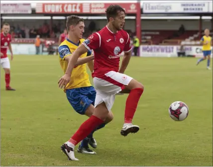  ??  ?? John Martin battles with Seamus Sharkey. Pics: Donal Hackett.