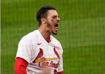  ?? AP Photo/Jef Roberson ?? St. Louis Cardinals’ Nolan Arenado celebrates after hitting a two-run home run during the eighth inning of a baseball game against the Milwaukee Brewers on Thursday in St. Louis.