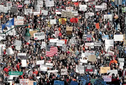  ?? PHOTO: AP ?? Students in Madison, Wisconsin join the mass school walkout across the US, one month after the deadly shooting at a high school in Parkland, Florida.