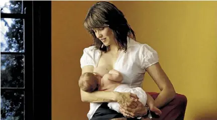  ??  ?? Breast is best, Lucy Lawless feeding her son Judah in the breastfeed­ing week poster.