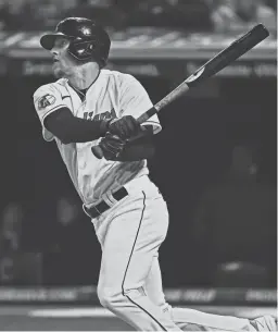  ?? KEN BLAZE/USA TODAY SPORTS ?? Guardians center fielder Myles Straw hits an RBI single against the Kansas City Royals on Sept. 30 in Cleveland.