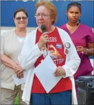  ?? DIGITAL FIRST MEDIA FILE PHOTO ?? Nurses at Pottstown Hospital, who are members of the Pennsylvan­ia Associatio­n of Staff Nurses and Allied Profession­als, have approved a three year contract. It is the hospital union’s first contract since it was formed two years ago. In this August 2018 file photo, Bernie Moser, a nurse who has worked at Pottstown Hospital for 35 years, talks during a nurses’ rally outside the hospital.