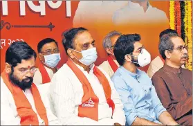  ?? HT FILE ?? Eknath Shinde (left) with Shiv Sena leader Aaditya Thackeray and CM Uddhav Thackeray at an event to mark the party’s Foundation Day in Mumbai on June 19.
