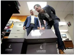  ?? Arkansas Democrat-Gazette/THOMAS METTHE ?? Cherokee Nation Businesses representa­tives Matt Perrier (left) and Ben Elder deposit the group’s amended Pope County casino applicatio­n Friday at the Arkansas Racing Commission office in Little Rock.