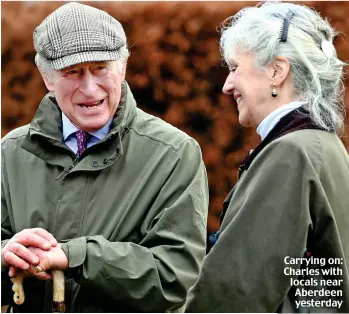  ?? ?? Carrying on: Charles with locals near Aberdeen yesterday