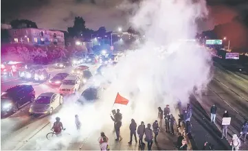  ??  ?? Protesters block both directions of the Interstate 580 freeway during a rally against racism in Oakland in response to a series of violent clashes that erupted in Charlottes­ville. — AFP photo