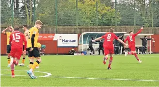  ?? ?? Delight Ross Mcgeachie wheels off to celebrate his stunning equaliser. Photos by Graham Hamilton