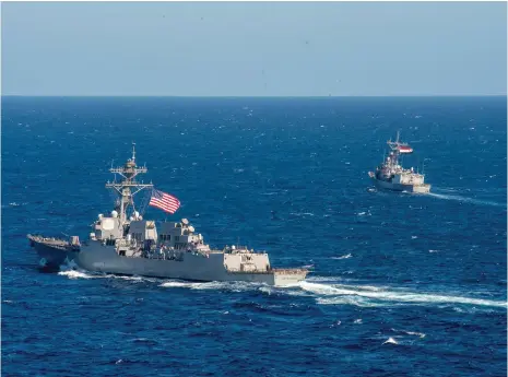  ?? Reuters ?? US Navy destroyer USS Jason Dunham and Egyptian Navy frigate ENS Alexandria are used in Red Sea exercises last year