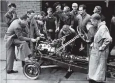  ??  ?? Students in
1941 get a look at the
inner workings
of an automobile through the gift of a cutaway
chassis donated by
the Ford Motor Co.