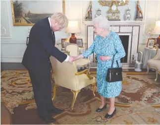  ?? (Reuters) ?? QUEEN ELIZABETH II welcomes Boris Johnson at Buckingham Palace yesterday.