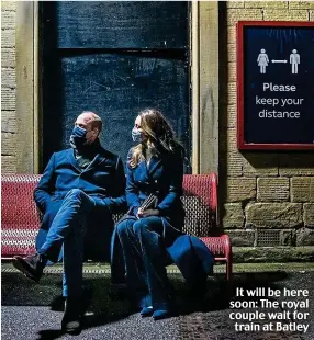  ??  ?? It will be here soon: The royal couple wait for train at Batley