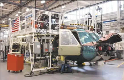  ?? Hearst Connecticu­t Media file photo ?? A Sikorsky UH-60M Black Hawk sits partially built on the line in the Military Assembly Building at Sikorsky Aircraft in Stratford in 2008.