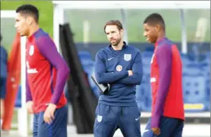  ?? PAUL ELLIS/AFP ?? England interim manager Gareth Southgate (centre) is satisfied that Manchester United’s Chris Smalling (left) and Luke Shaw are genuinely injured.