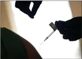  ?? DAVID GOLDMAN — THE ASSOCIATED PRESS ?? A droplet falls from a syringe after a health care worker was injected with the Pfizer-BioNTech COVID-19 vaccine at Women & Infants Hospital in Providence, R.I.