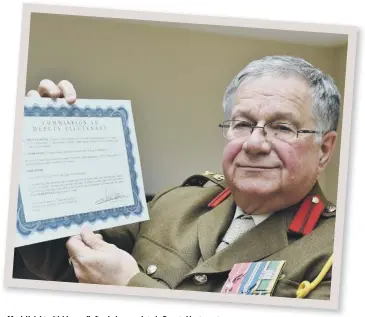  ??  ?? Mark Knight with his scroll after being appointed a Deputy Lieutenant